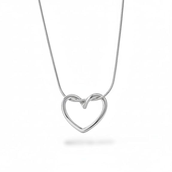 A silver open heart pendant necklace on a delicate silver snake chain, shown against a plain white background with a soft shadow below.